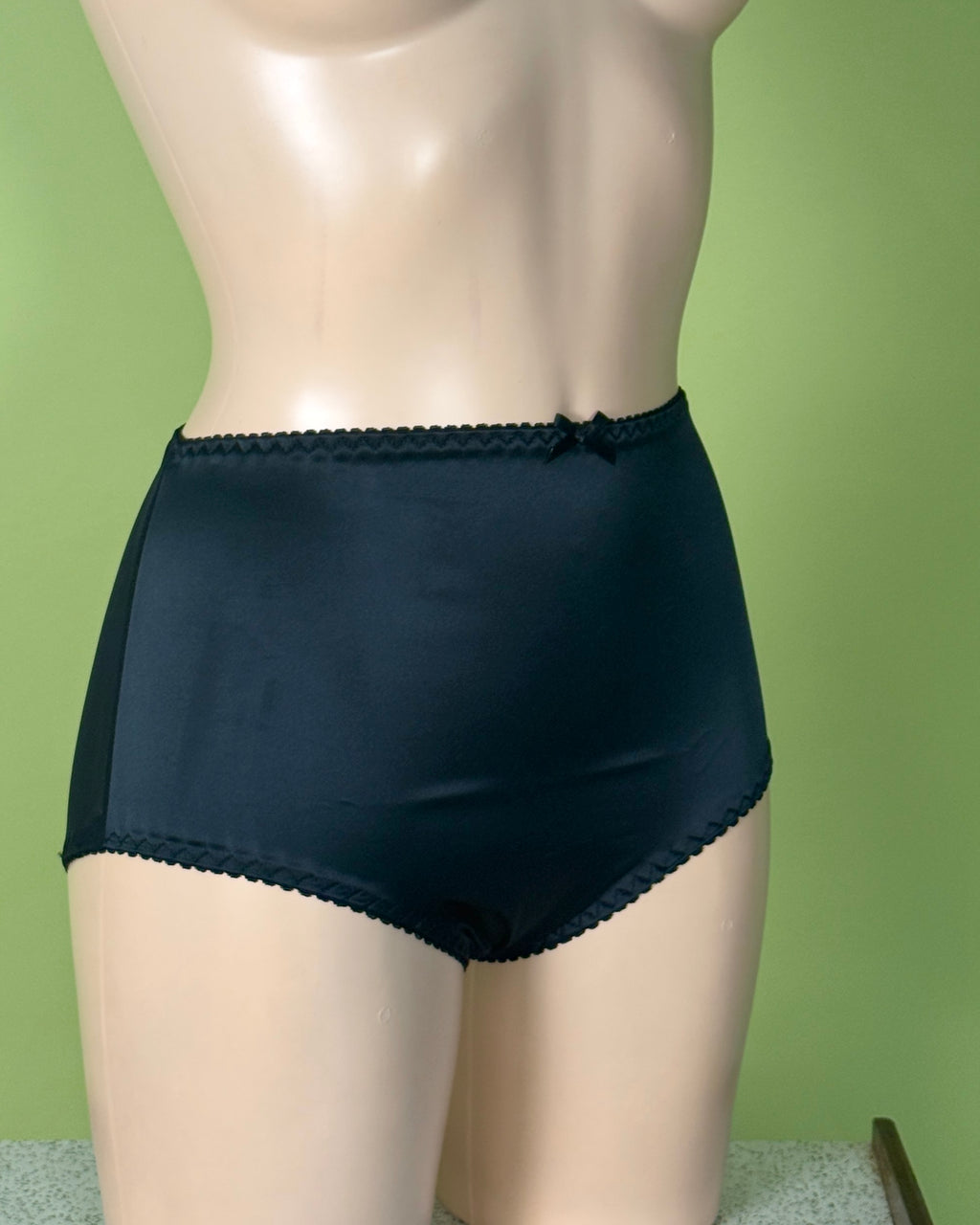 Back satin Knickers on a Manneqin shot against green background