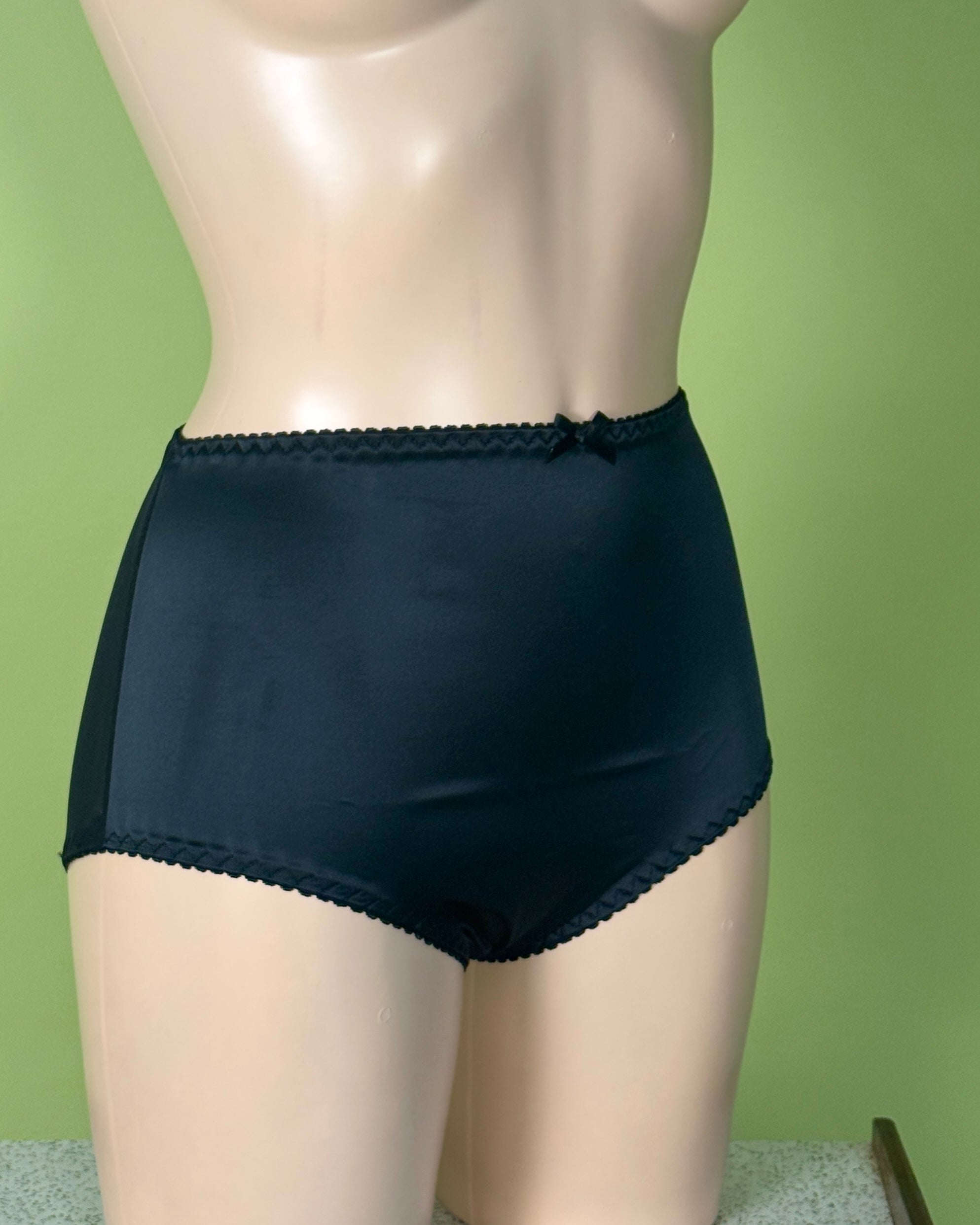 Back satin Knickers on a Manneqin shot against green background