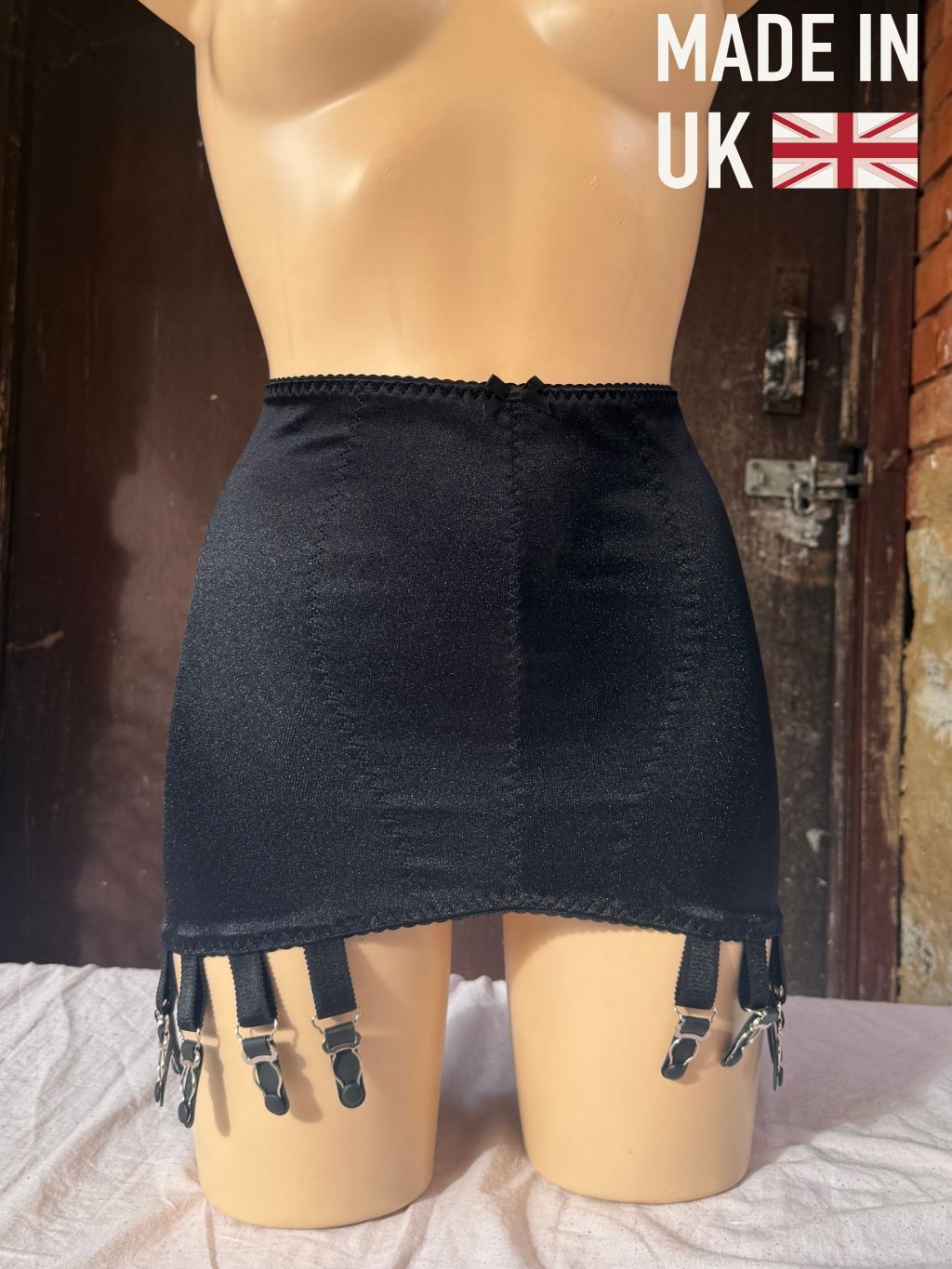 14 strap black girdle with a made in uk sign