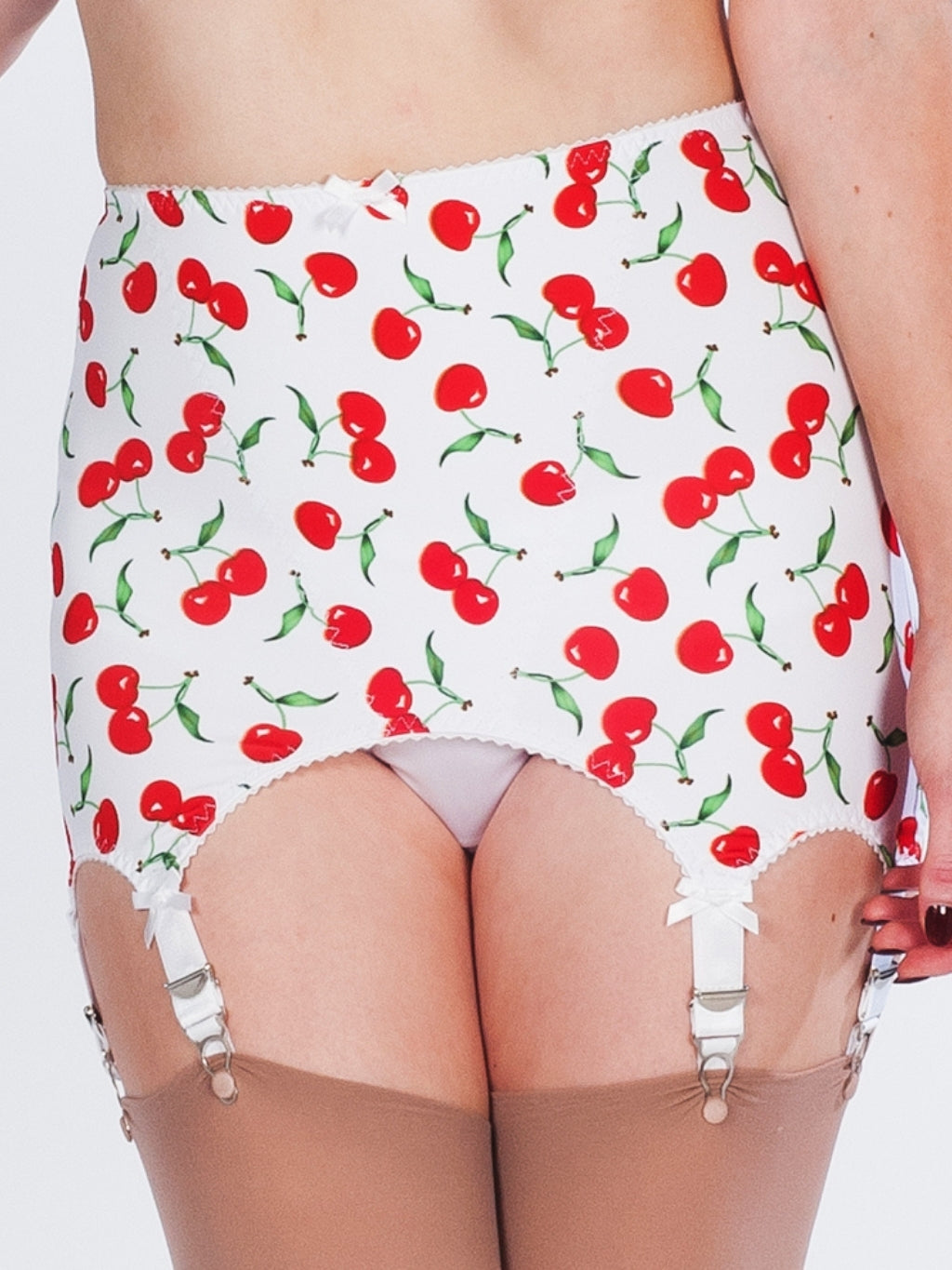 Girdle with cherry pattern and suspenders on a white background