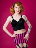 Pink and Black Striped girdle with black bow detailing on red background.