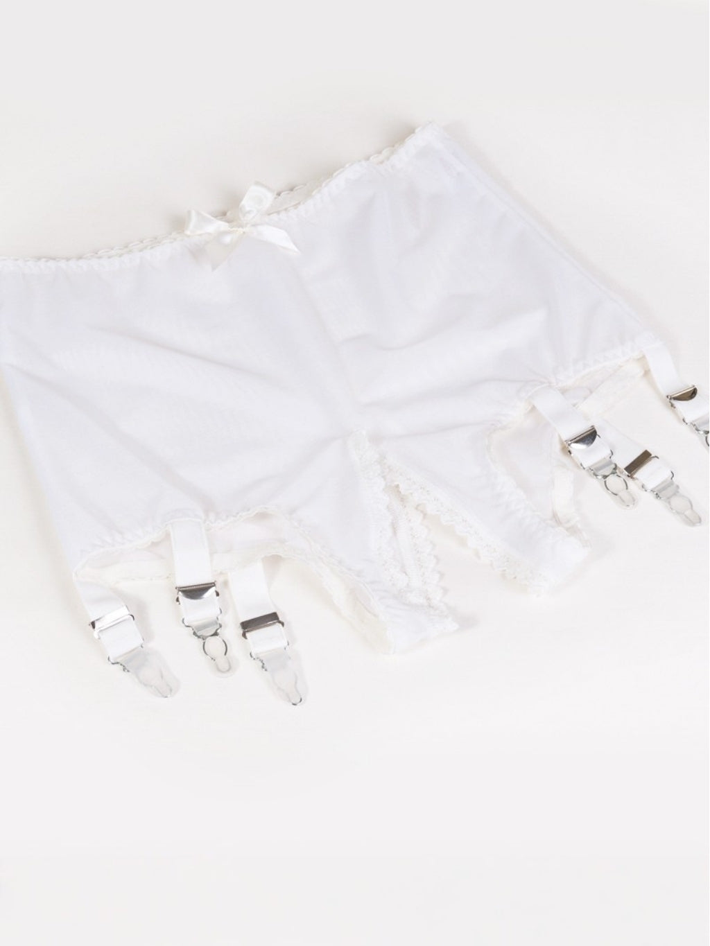 cream pantry girdle with cream suspenders and a crotchless design upon a white background