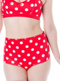 Red polka dot lingerie set on a white background